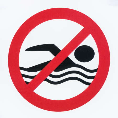 no swimming sign at a lake