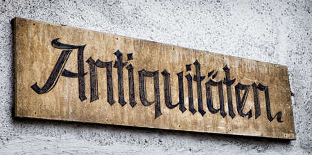 old sign for an antique shop in german