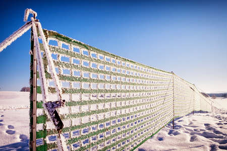 fence against snowdrift at the alps