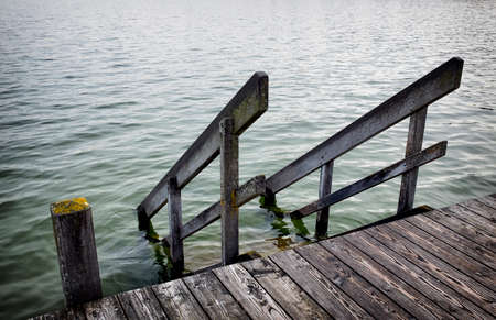 old wooden jetty at a lakeの写真素材
