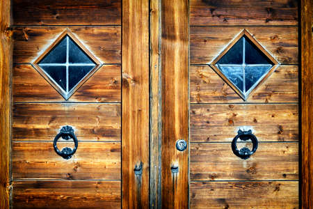 old doorknocker at a historic front doorの写真素材