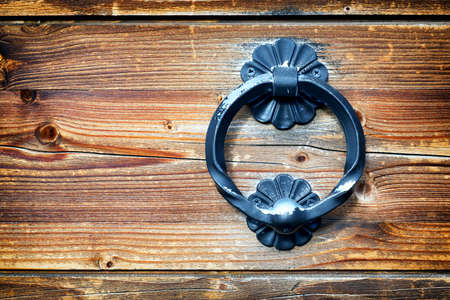 old doorknocker at a historic front doorの写真素材