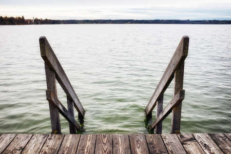 old wooden jetty at a lakeの写真素材