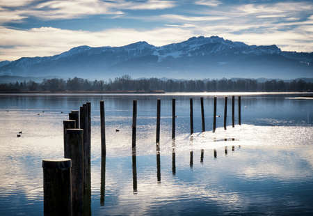 bollards at the chiemsee lake in bavariaの写真素材
