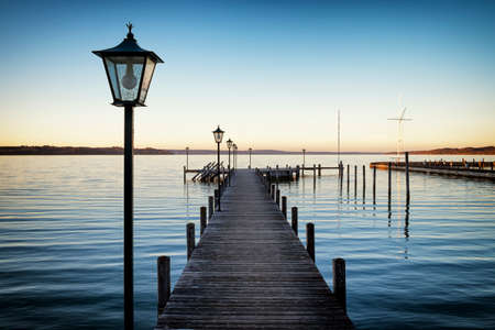 old wooden jetty at a lakeの写真素材