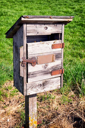 beautiful old letterbox at a meadowの写真素材