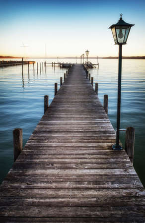 old wooden jetty at a lakeの写真素材