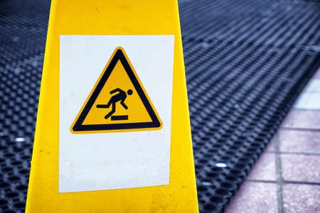 caution wet floor sign at a corridorの写真素材
