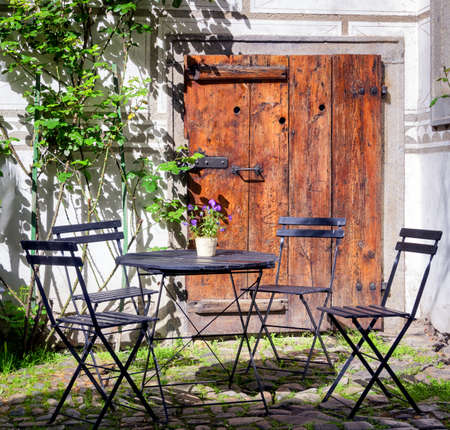folding chair and table at a patioの写真素材