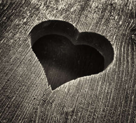 wooden heart at an antique restroom-doorの写真素材