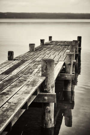 old wooden jetty at a lakeの写真素材