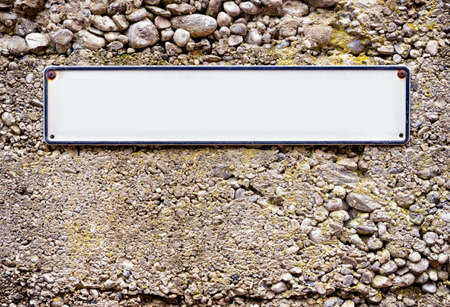 blank sign at a wall  background with space for textの写真素材