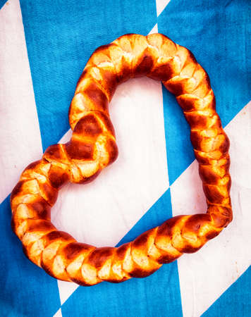 typical souvenir at the oktoberfest in munich - a gingerbread heart - lebkuchenherzの写真素材