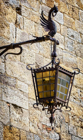 beautiful historic streetlamp and brick wallの写真素材