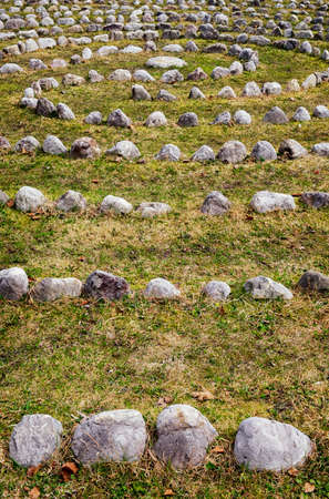 curves of rocks at a meadowの写真素材