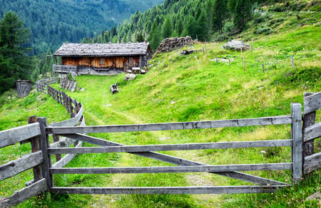 old log cabin at the european alpsの写真素材