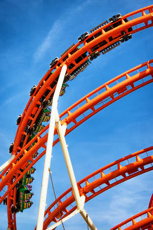 part of a roller coaster in front of blue skyの写真素材