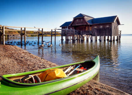 old wooden boathouse at a lakeの写真素材