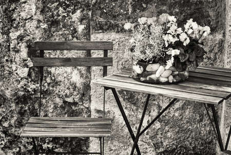 table and chair at a sidewalk cafeの写真素材