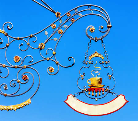 beautiful old store sign in front of sky