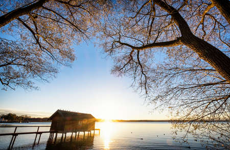 old wooden boathouse at a lakeの写真素材