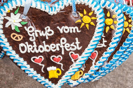 typical souvenir at the oktoberfest in munich - a gingerbread heart - lebkuchenherzの写真素材