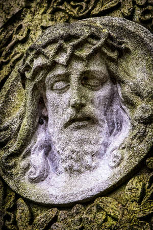 old jesus christ relief at a historic gravestoneの写真素材