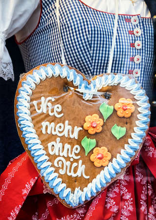 typical souvenir at the oktoberfest in munich - a gingerbread heart - lebkuchenherzの写真素材