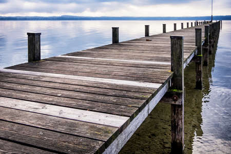 old wooden jetty at the chiemsee lake in bavariaの写真素材