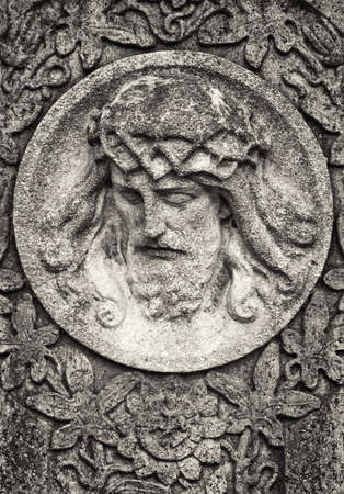 old jesus christ relief at a historic gravestoneの写真素材