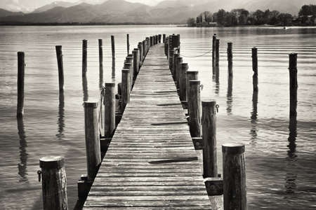 old wooden jetty at a lakeの写真素材