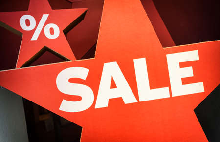 red sale sign at a doorの写真素材