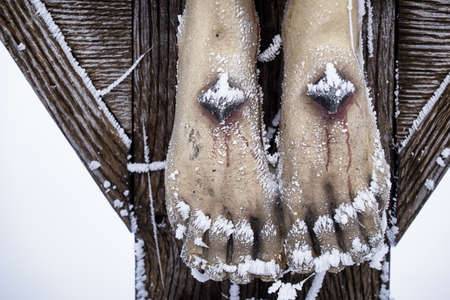 cross in winter - austriaの写真素材