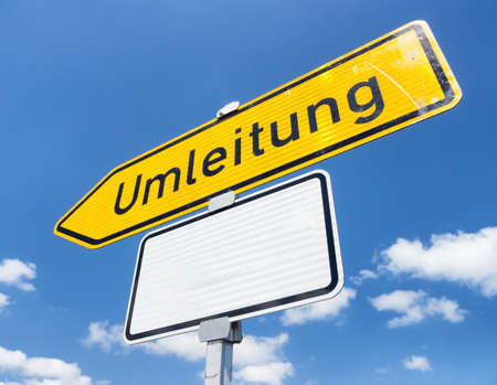 german diversion sign in front of skyの写真素材