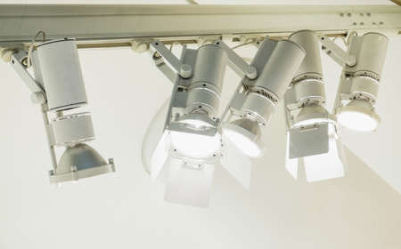 modern spotlights at a wall - space for text