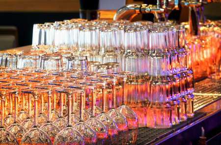 glasses at a bar counterの写真素材