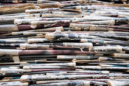 tower of old weathered newspapersの写真素材