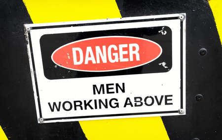 men at work sign at a construction siteの写真素材