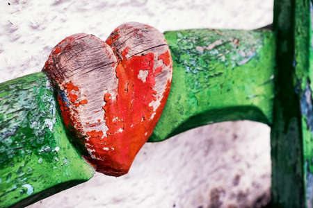 wooden heart at an antique restroom-doorの写真素材