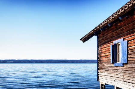old wooden boathouse at a lakeの写真素材