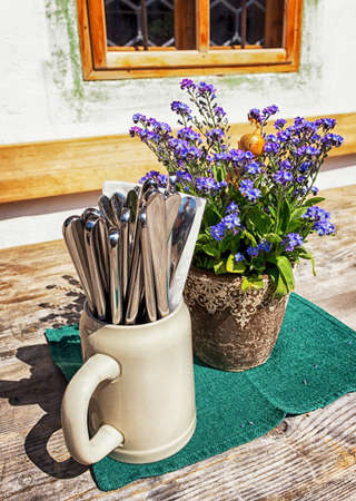 typical mug and silverware at a bavarian beergardenの写真素材