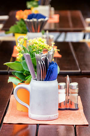 typical mug and silverware at a bavarian beergardenの写真素材