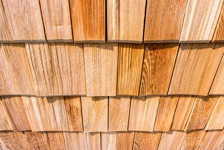 small wooden shingles at a facade - nice backgroundの写真素材