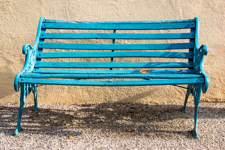 old bench in front of a wallの写真素材