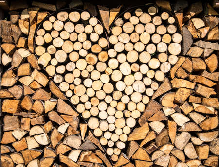 close-up of a firewood heap - heart shape