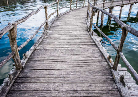 old bridge at a lakeの写真素材