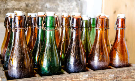 old bottles in wooden boxesの写真素材