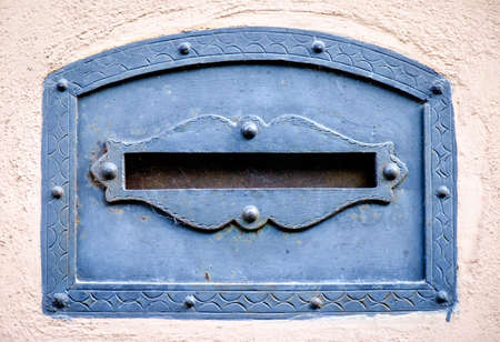 old letterbox at a historic facadeの写真素材