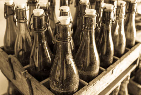 old bottles in wooden boxesの写真素材