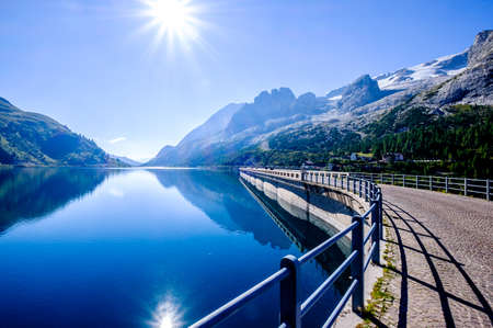 lago di fedaia at the marmolada - the highest mountain at the european dolomites - with reservoirの写真素材